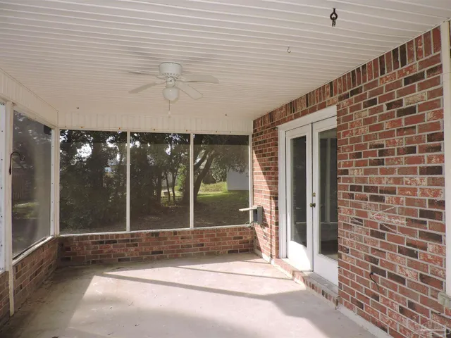 a view of a brick house with a glass door