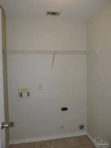 a view of small space with racks on the wall