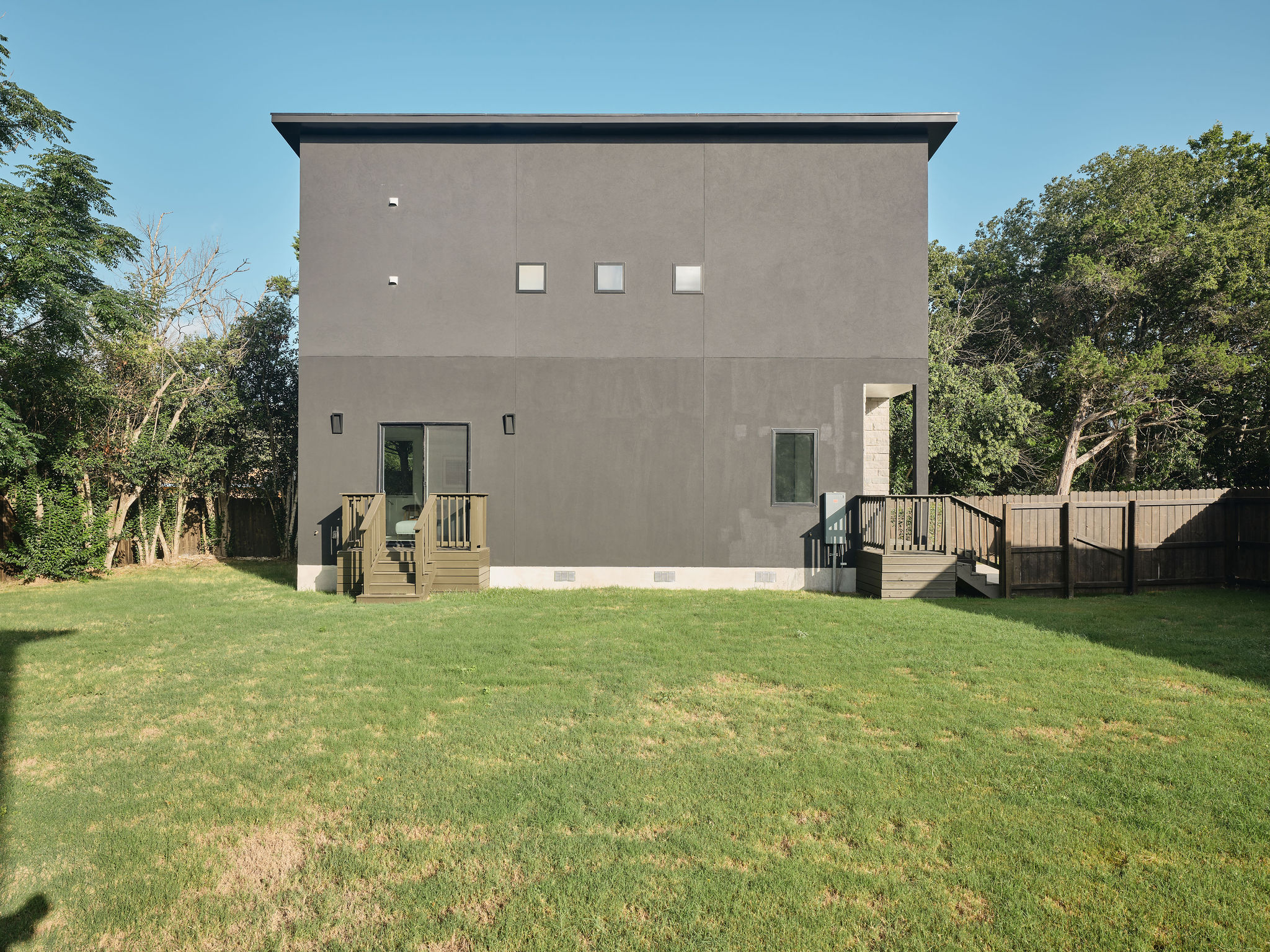 2611 Davis Lane, Unit 2 Austin, TX 78745 - Photo 23 of 23 Rear view of house featuring crawl space and stucco siding