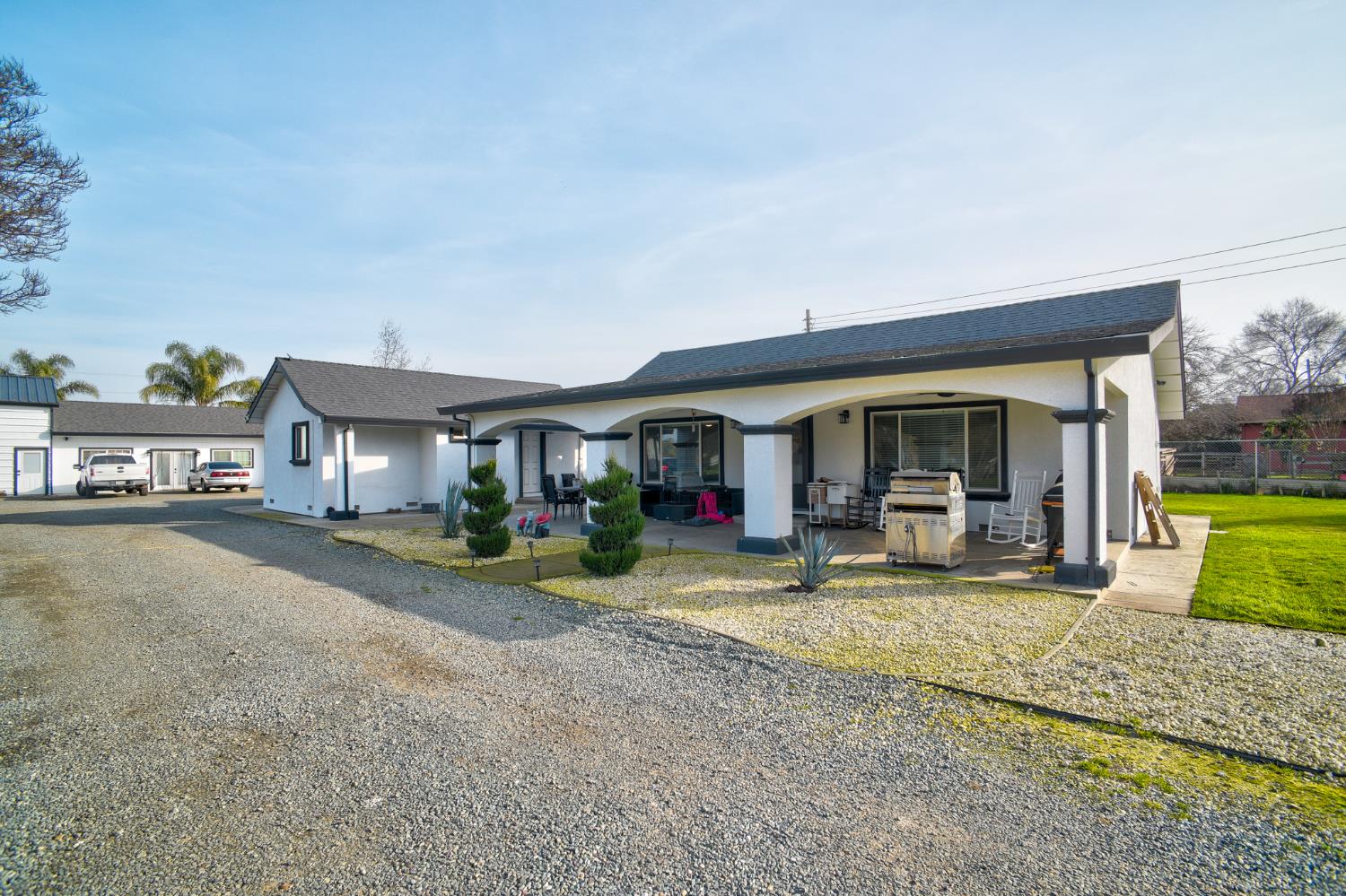 8567 Bradshaw Road Elk Grove, CA 95624 - Photo 2 of 12 a view of a house with backyard porch and sitting area