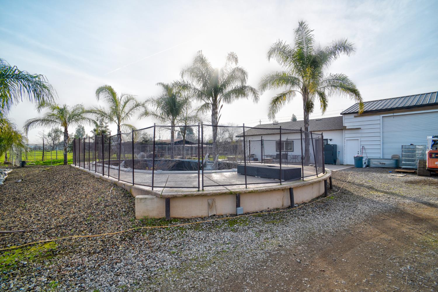 8567 Bradshaw Road Elk Grove, CA 95624 - Photo 7 of 12 a view of a backyard with a patio and swimming pool