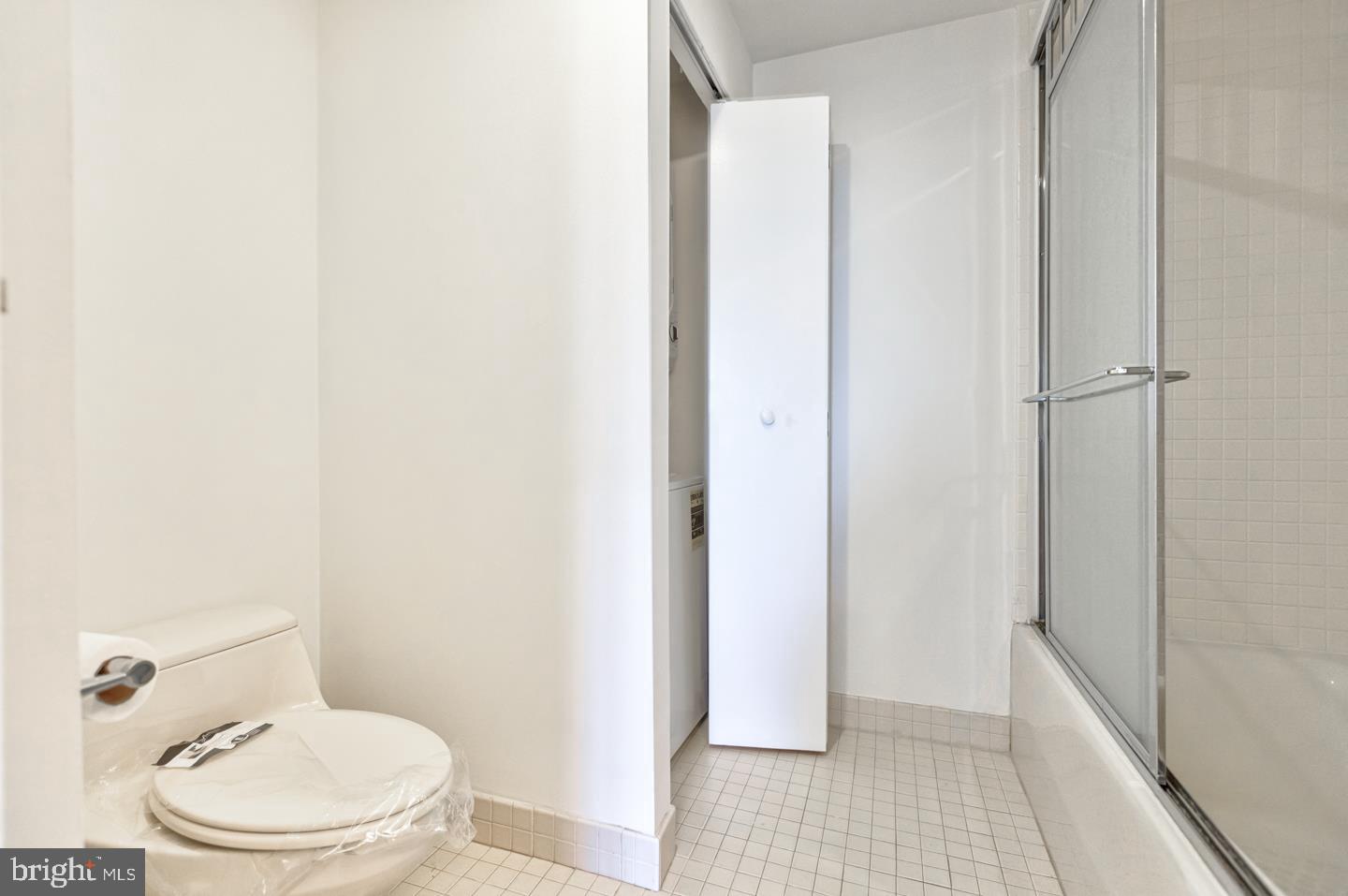 202-10 West Rittenhouse Square, Unit 1705 Philadelphia, PA 19103 - Photo 17 of 28 a white toilet sitting next to a shower