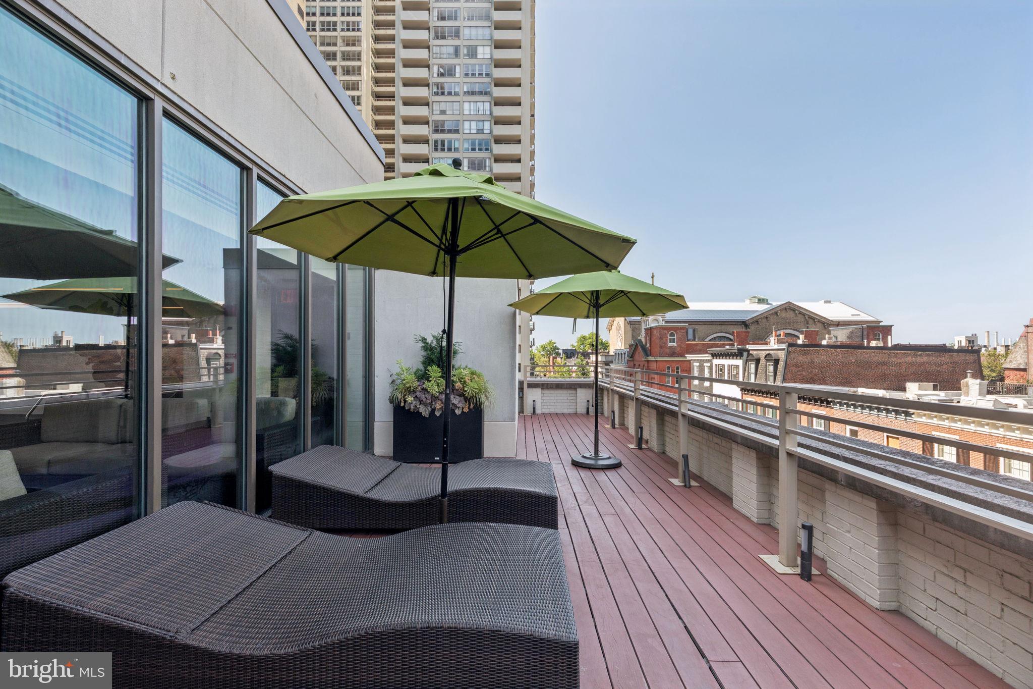 202-10 West Rittenhouse Square, Unit 1705 Philadelphia, PA 19103 - Photo 22 of 28 a view of a rooftop deck with couch and chairs