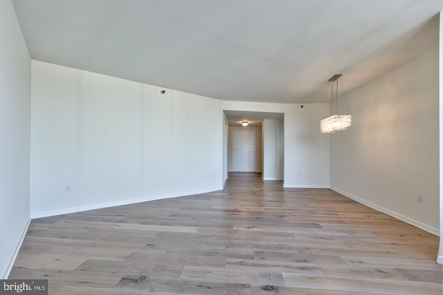 202-10 West Rittenhouse Square, Unit 1705 Philadelphia, PA 19103 - Photo 3 of 28 a view of an empty room and wooden floor