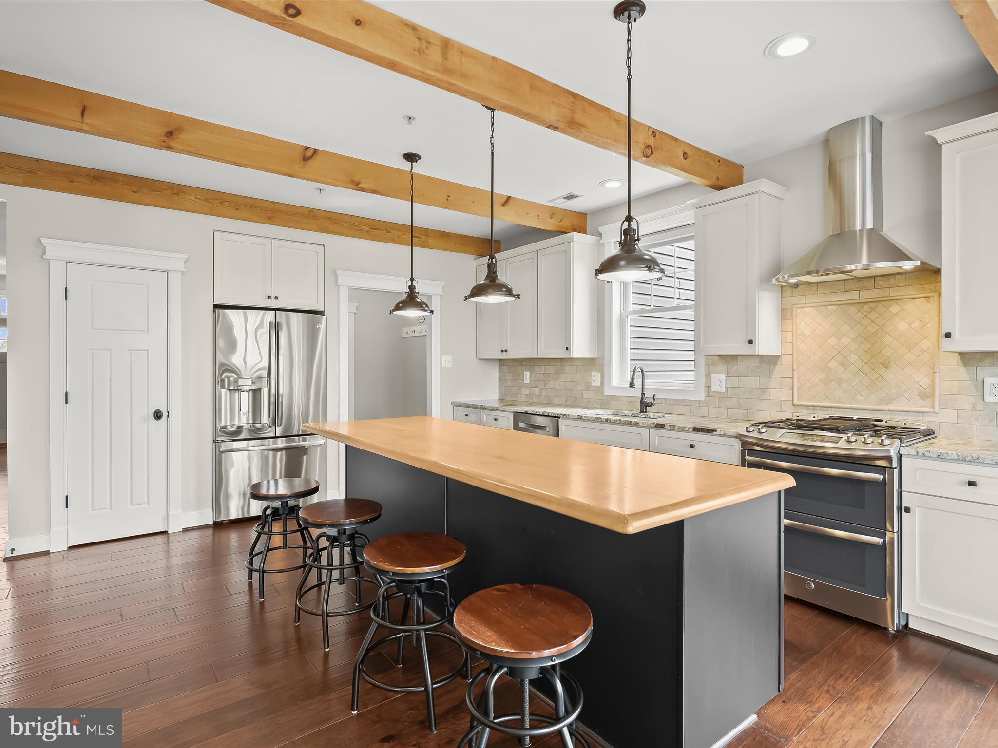 17263 Hardy Road Mount Airy, MD 21771 - Photo 23 of 98 a kitchen with stainless steel appliances granite countertop a sink a stove and chairs