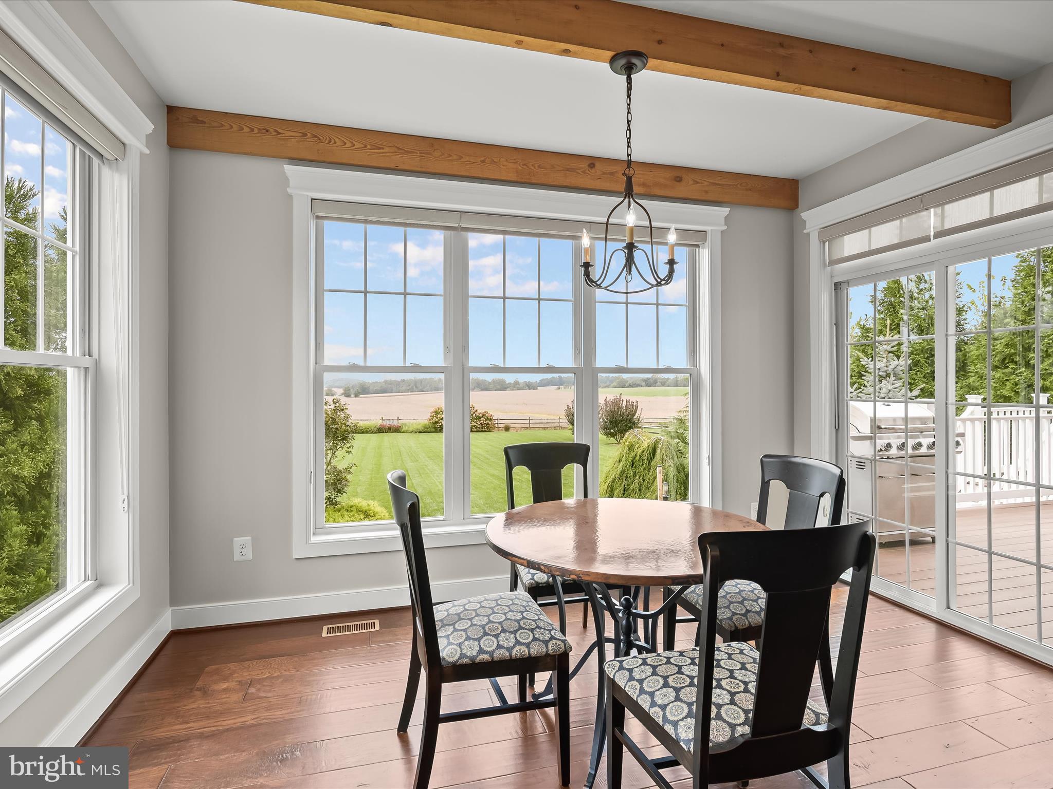 17263 Hardy Road Mount Airy, MD 21771 - Photo 28 of 98 a view of a dining room with furniture a chandelier and wooden floor