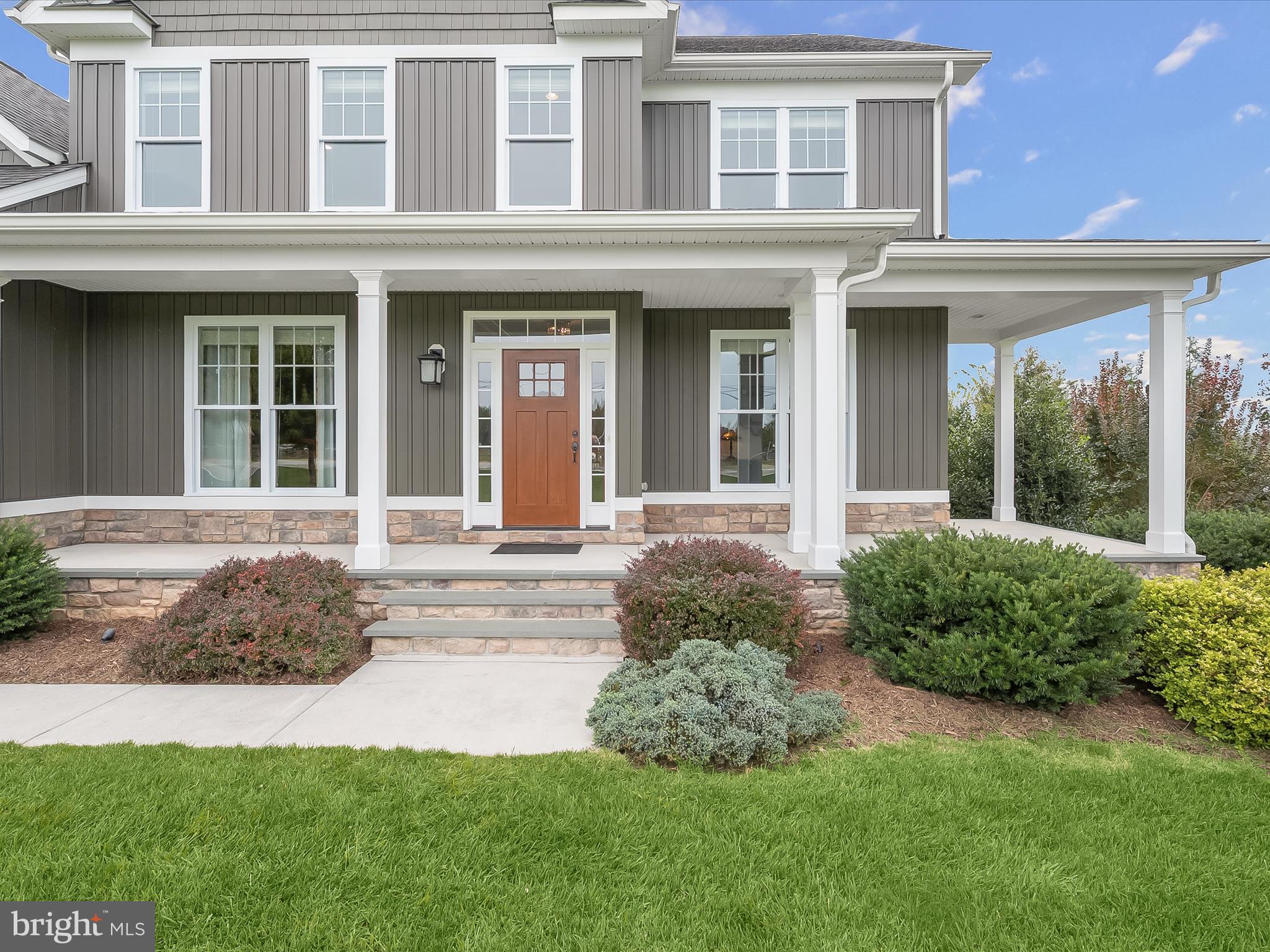 17263 Hardy Road Mount Airy, MD 21771 - Photo 74 of 98 front view of a brick house with a yard