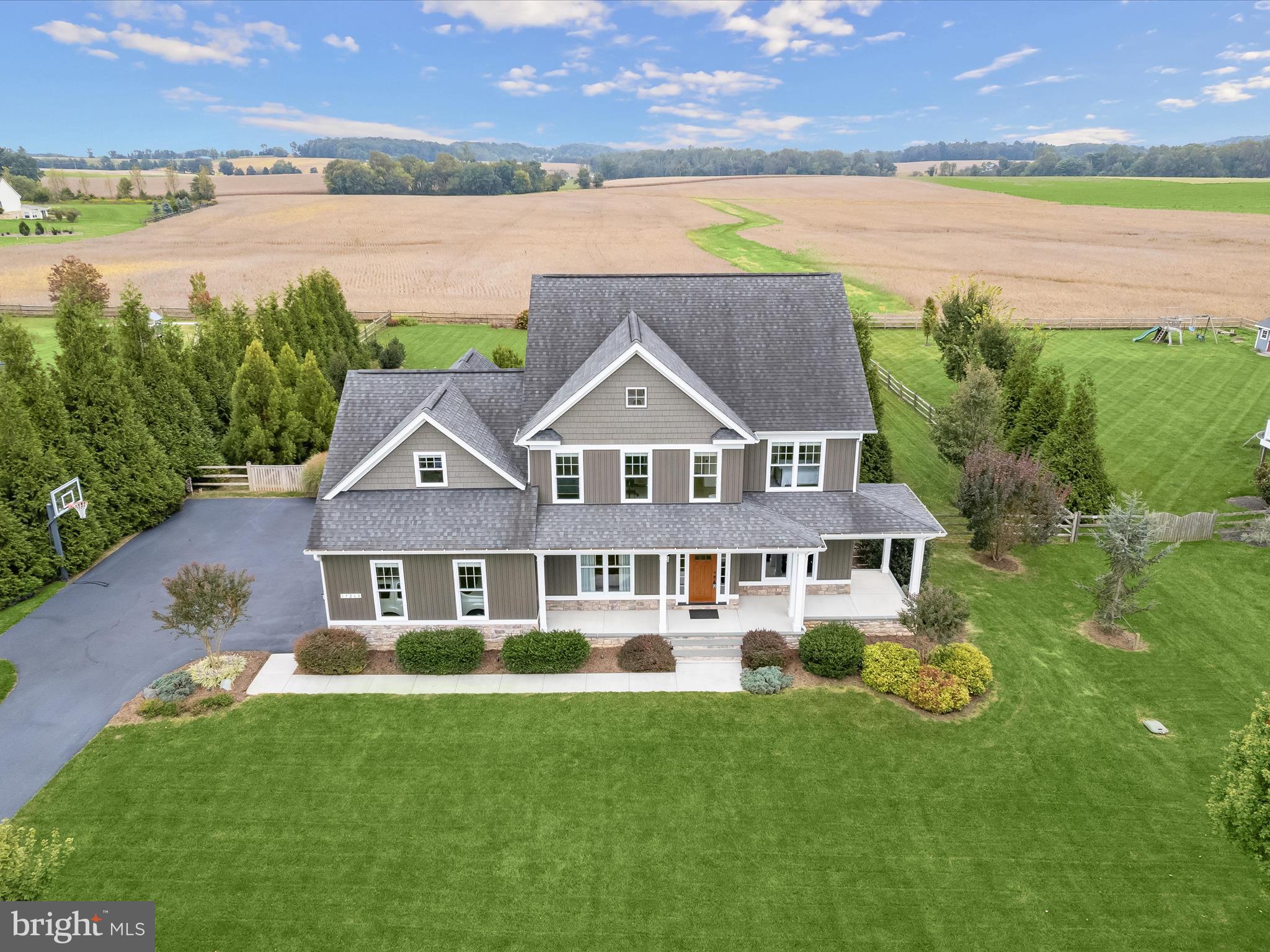 17263 Hardy Road Mount Airy, MD 21771 - Photo 88 of 98 a aerial view of a house with a garden and lake view