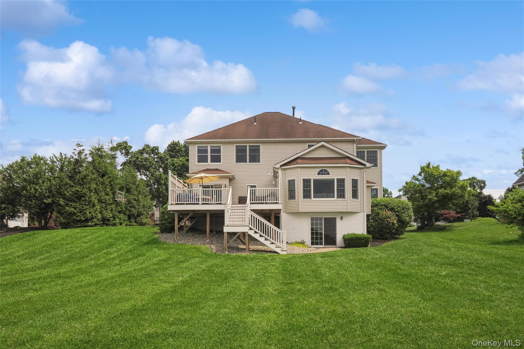 241 Old Castle Point Road Wappingers Falls, NY 12590 - Photo 4 of 19 Well kept lawn looking to the back of the house and large deck.