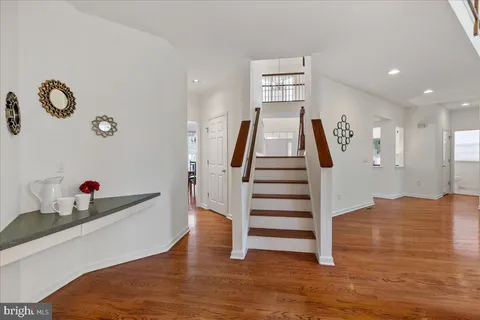 a view of entryway with wooden floor
