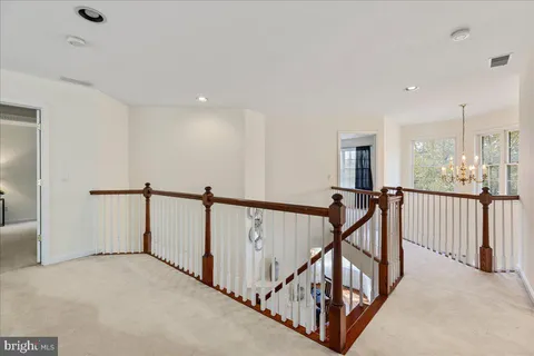 a view of a hallway with staircase