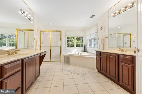 a large kitchen with a large counter top sink and cabinets