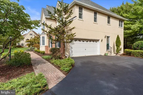 a aerial view of a house with a yard basket ball court and outdoor seating