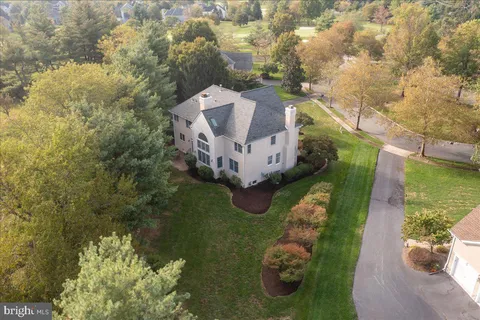 an aerial view of a houses with outdoor space and river