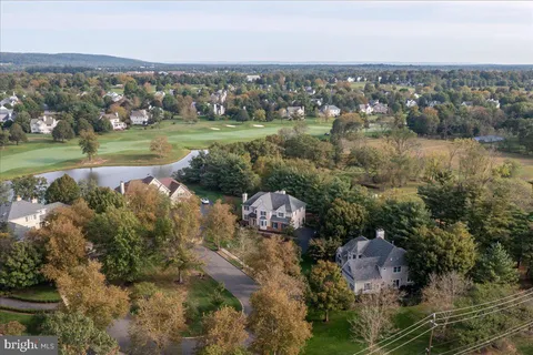 an aerial view of a house with outdoor space