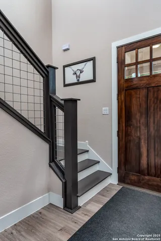 a kitchen with wooden cabinets and a stove top oven