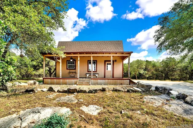 a view of a room with wooden floor and windows