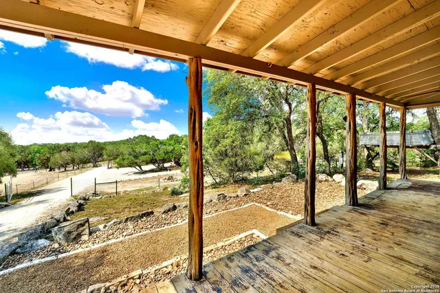 a view of balcony with couch and wooden floor