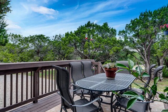 a view of balcony with wooden floor