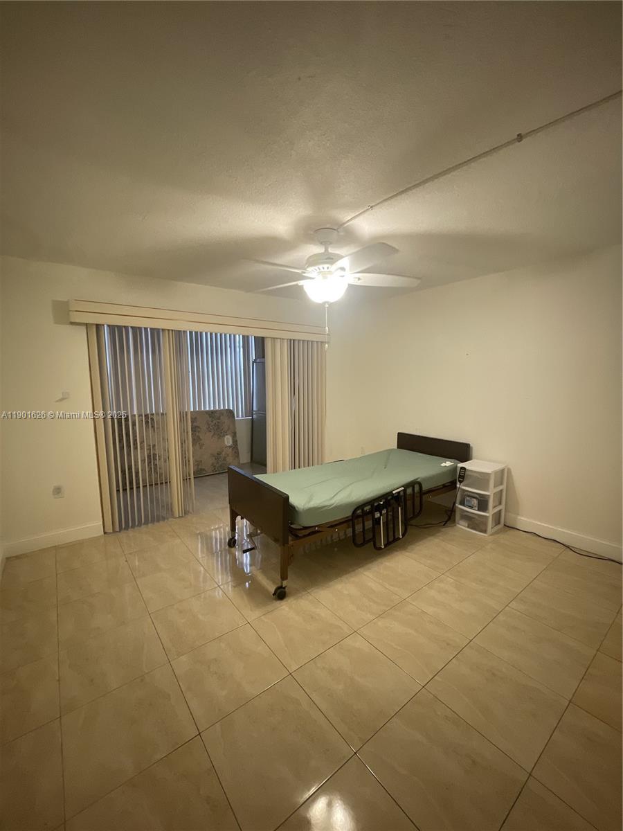 1305 West 46th Street, Unit 112 Hialeah, FL 33012 - Photo 8 of 11 a room with furniture