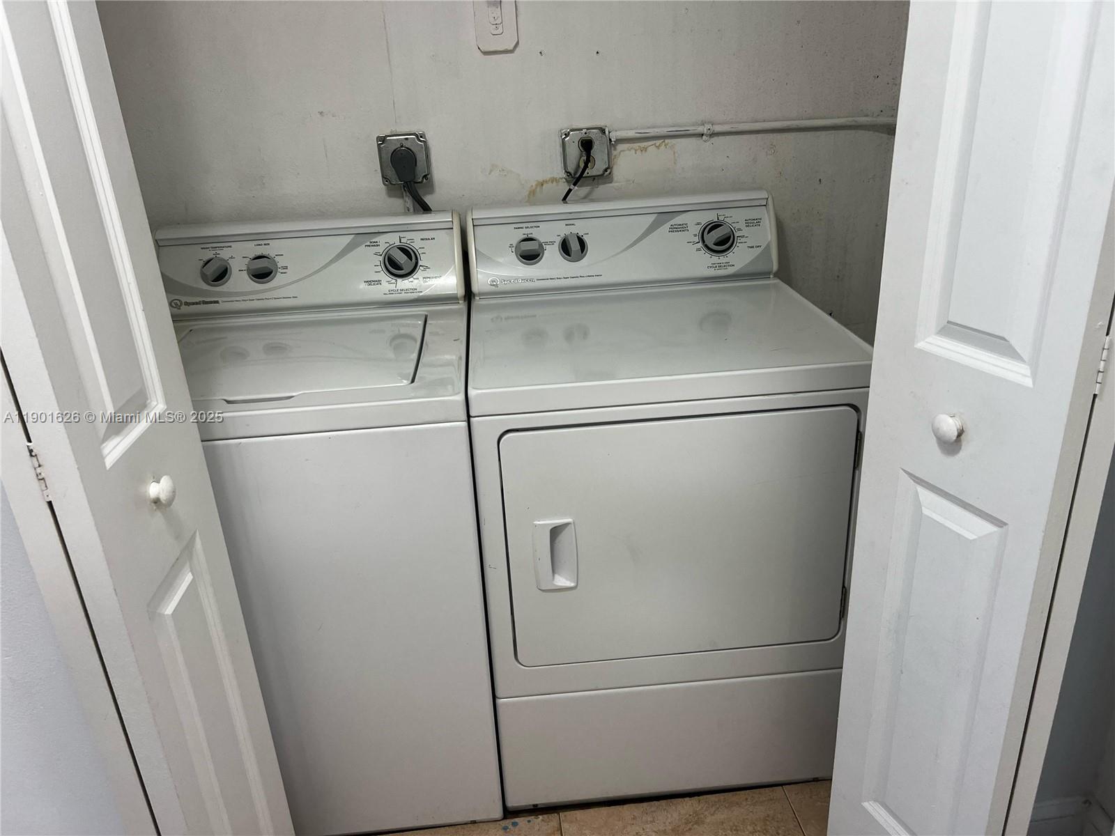 1305 West 46th Street, Unit 112 Hialeah, FL 33012 - Photo 10 of 11 a close up view of washer and dryer