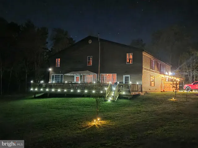 a view of a backyard with sitting area
