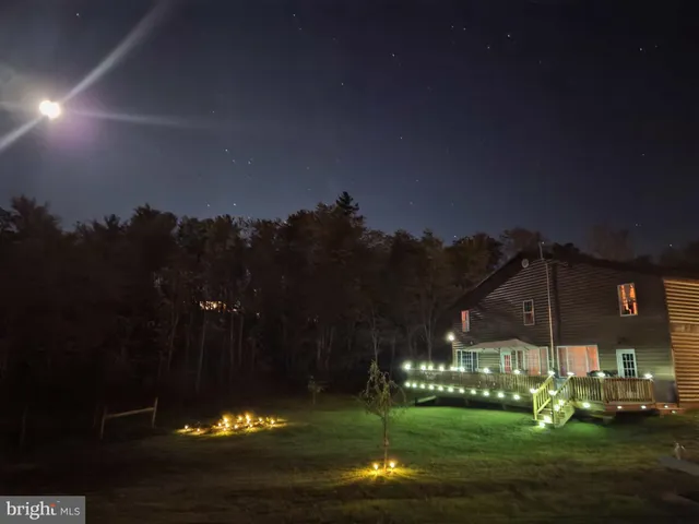 a view of entryway with wooden floor and stairs