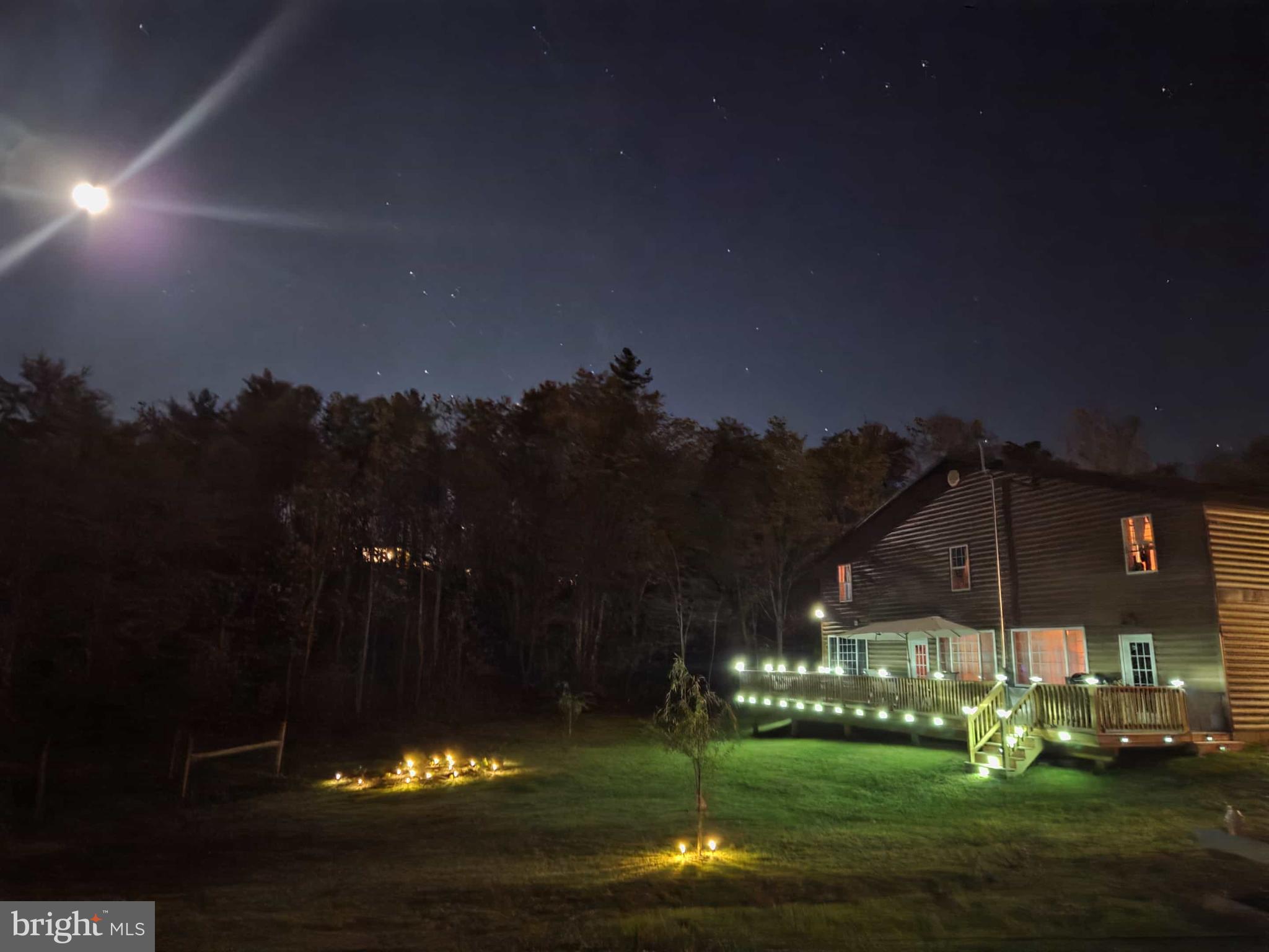 198 North Hunter Run Road Howard, PA 16841 - Photo 16 of 69 a view of a fountain in front of the house with a yard