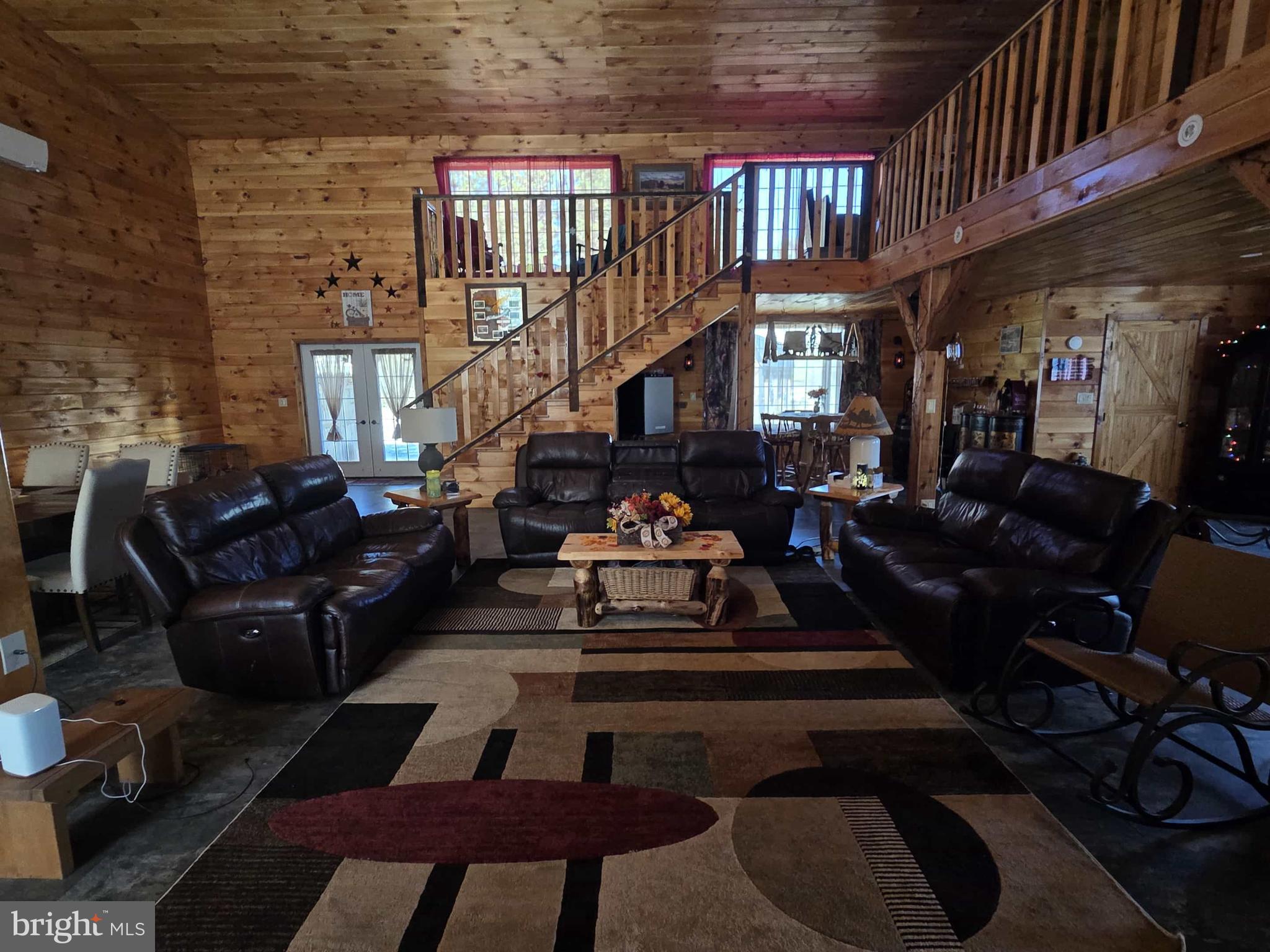 198 North Hunter Run Road Howard, PA 16841 - Photo 27 of 69 a living room with furniture fireplace and a rug