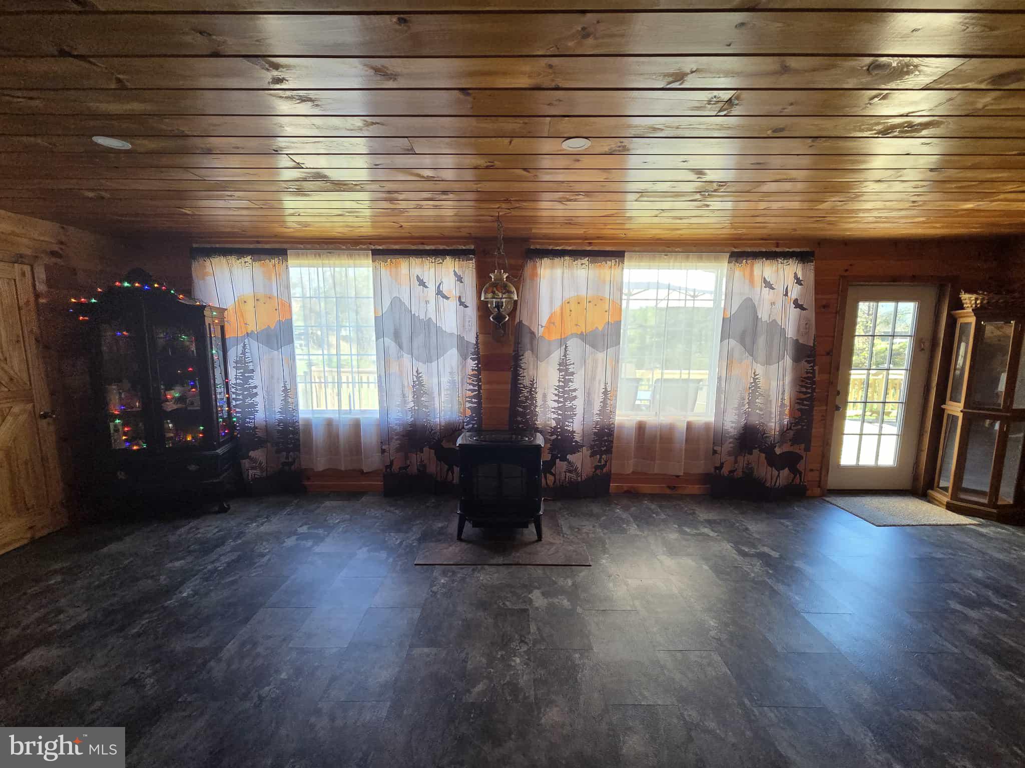 198 North Hunter Run Road Howard, PA 16841 - Photo 29 of 69 an empty room with wooden floor and windows