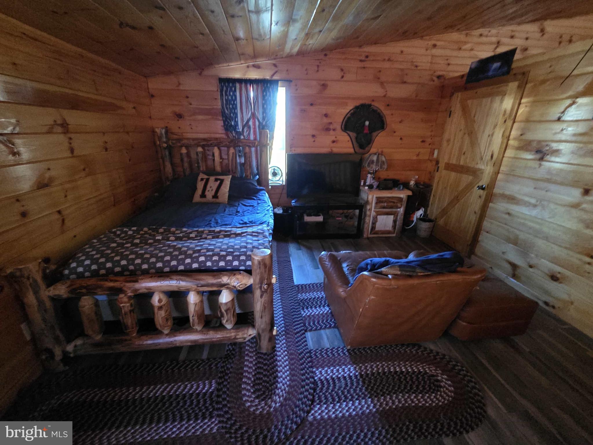 198 North Hunter Run Road Howard, PA 16841 - Photo 35 of 69 a living room with furniture and a fireplace