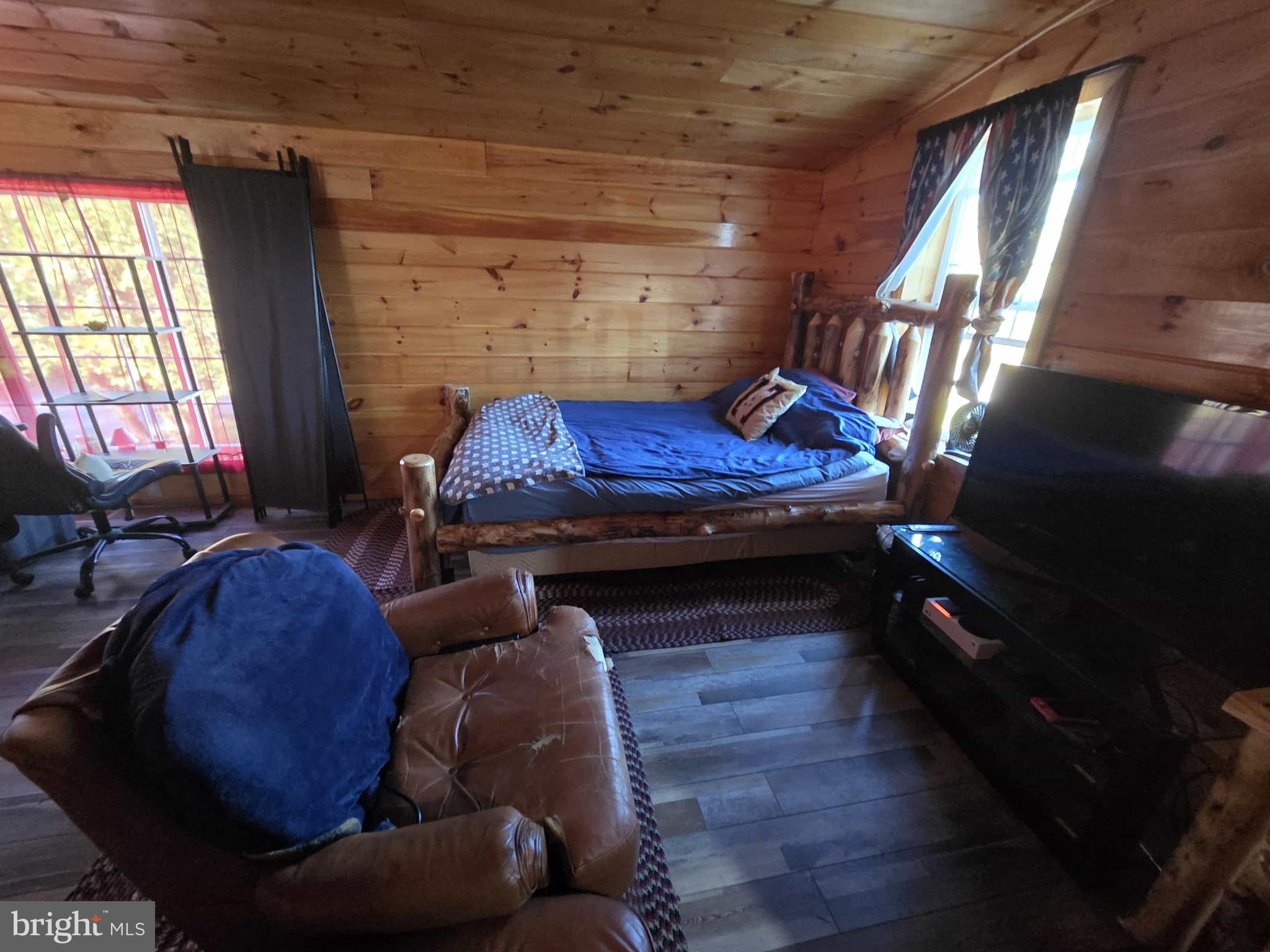 198 North Hunter Run Road Howard, PA 16841 - Photo 36 of 69 a bedroom with furniture and a fireplace