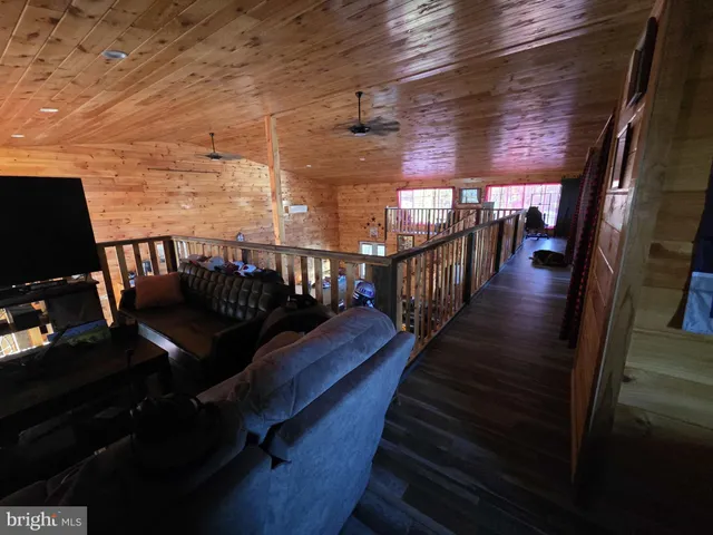 a view of a swimming pool with a table in a pots