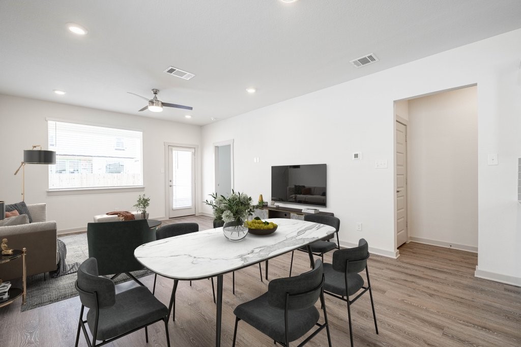 225 New Hampton Way San Marcos, TX 78666 - Photo 16 of 34 a view of a dining room with furniture and wooden floor
