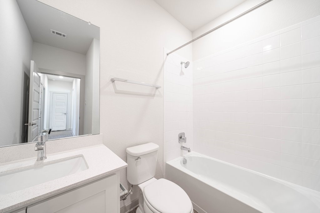 225 New Hampton Way San Marcos, TX 78666 - Photo 31 of 34 a bathroom with a sink toilet and shower