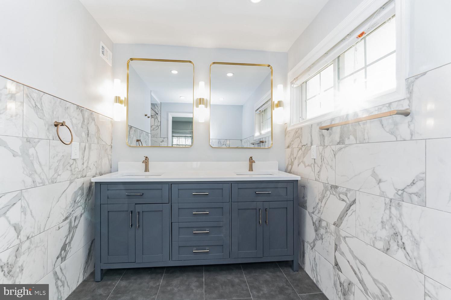 7016 Donna Circle Annandale, VA 22003 - Photo 14 of 30 a spacious bathroom with sink mirror and double