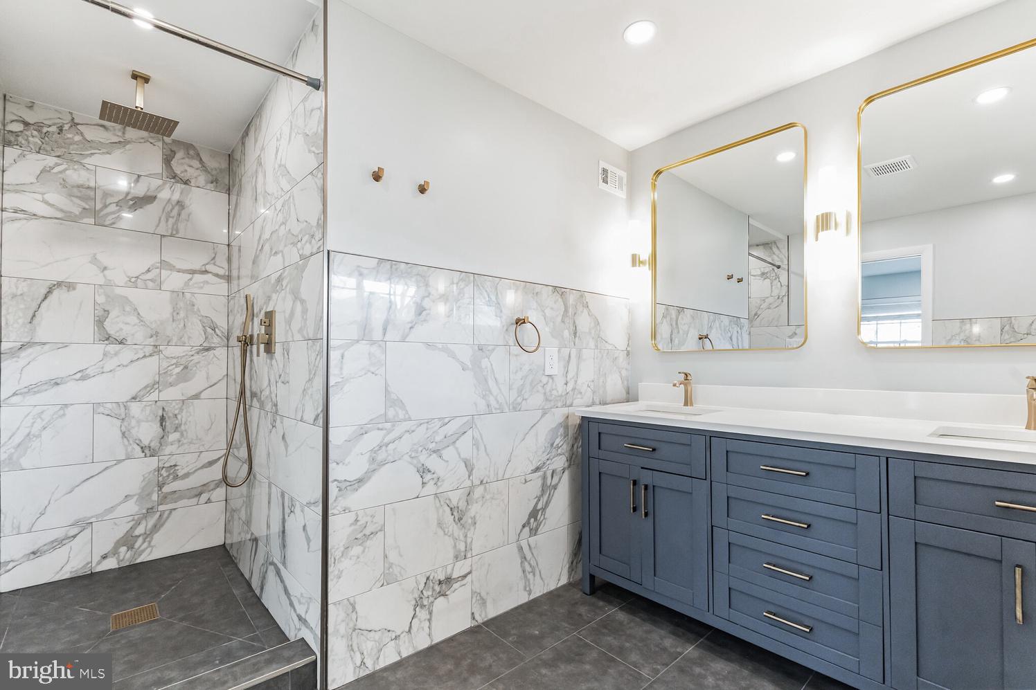 7016 Donna Circle Annandale, VA 22003 - Photo 16 of 30 a spacious bathroom with a granite countertop sink mirror and double