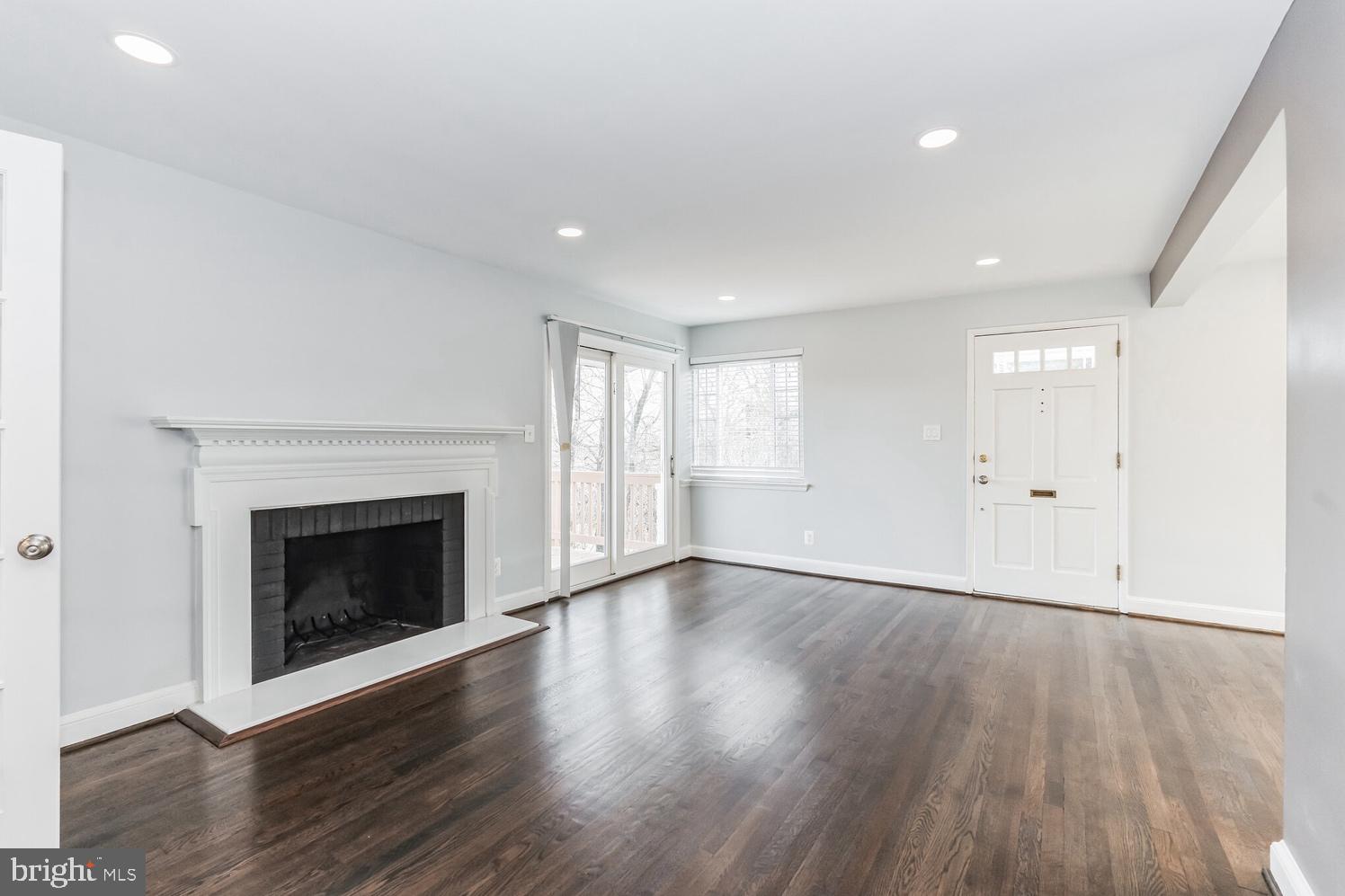 7016 Donna Circle Annandale, VA 22003 - Photo 18 of 30 a view of an empty room with wooden floor fireplace and a window