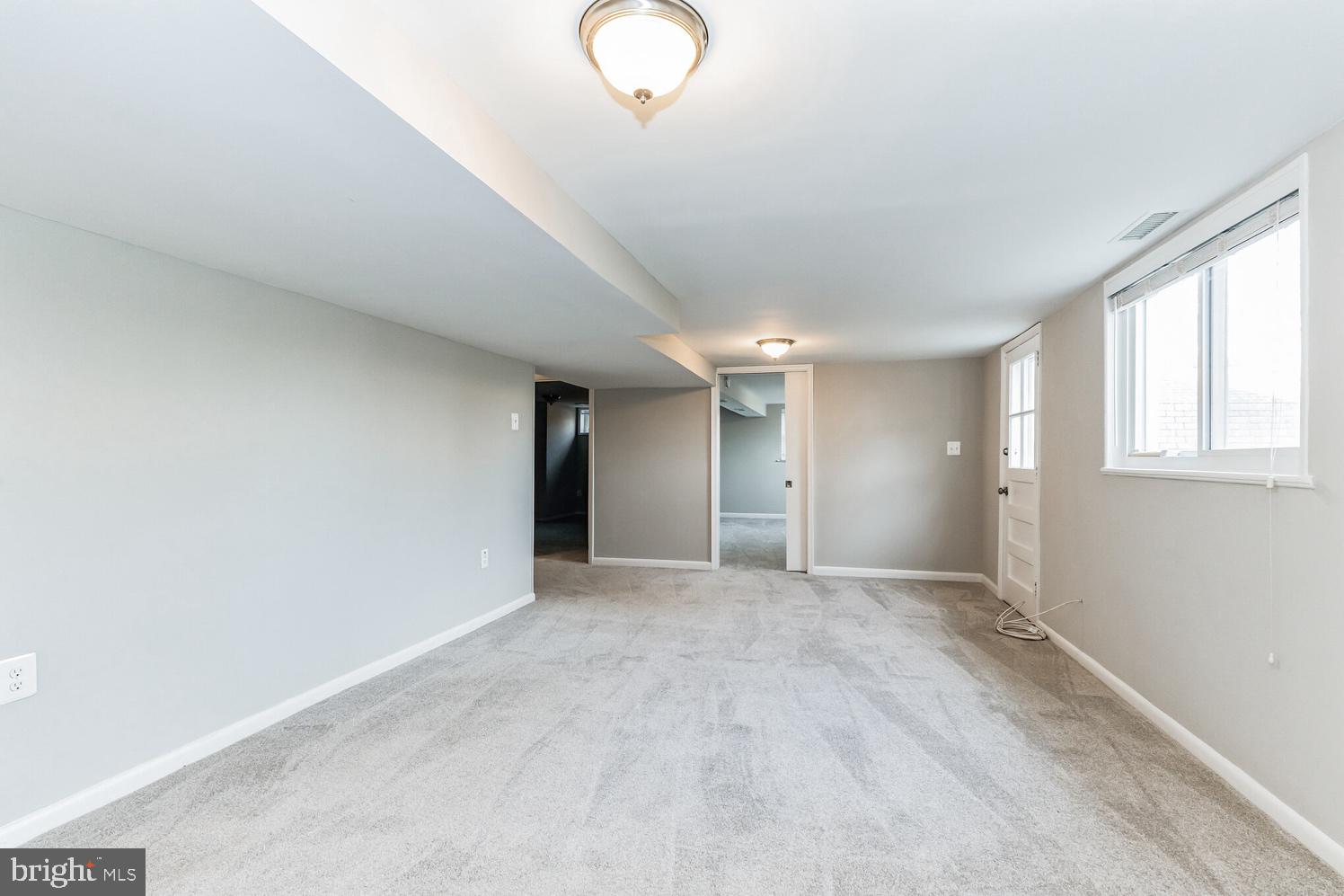 7016 Donna Circle Annandale, VA 22003 - Photo 19 of 30 a view of an empty room with window and wooden floor
