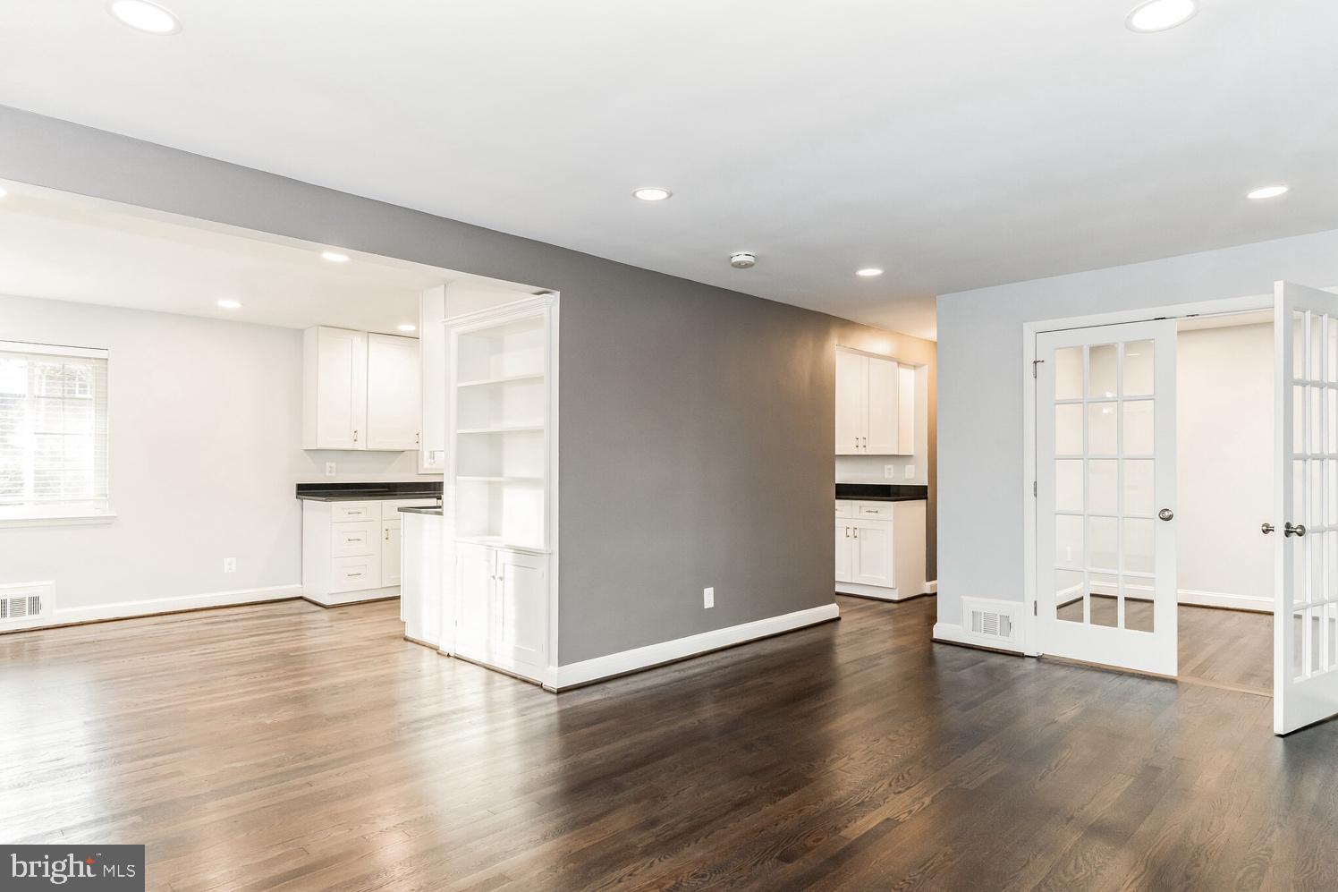 7016 Donna Circle Annandale, VA 22003 - Photo 2 of 30 a view of an empty room with wooden floor and a window