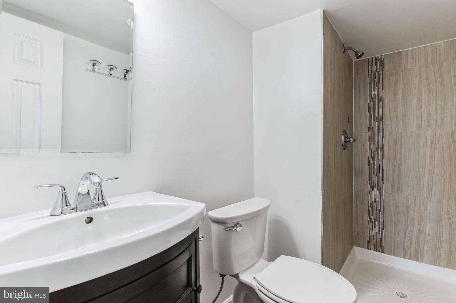 7016 Donna Circle Annandale, VA 22003 - Photo 22 of 30 a bathroom with a sink toilet and shower