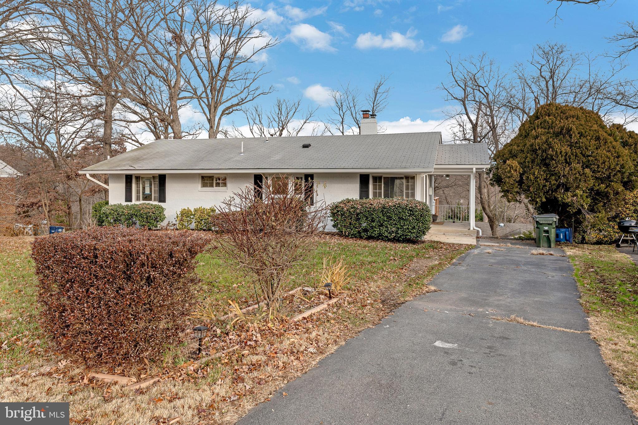 7016 Donna Circle Annandale, VA 22003 - Photo 27 of 30 a front view of a house with a yard and garage
