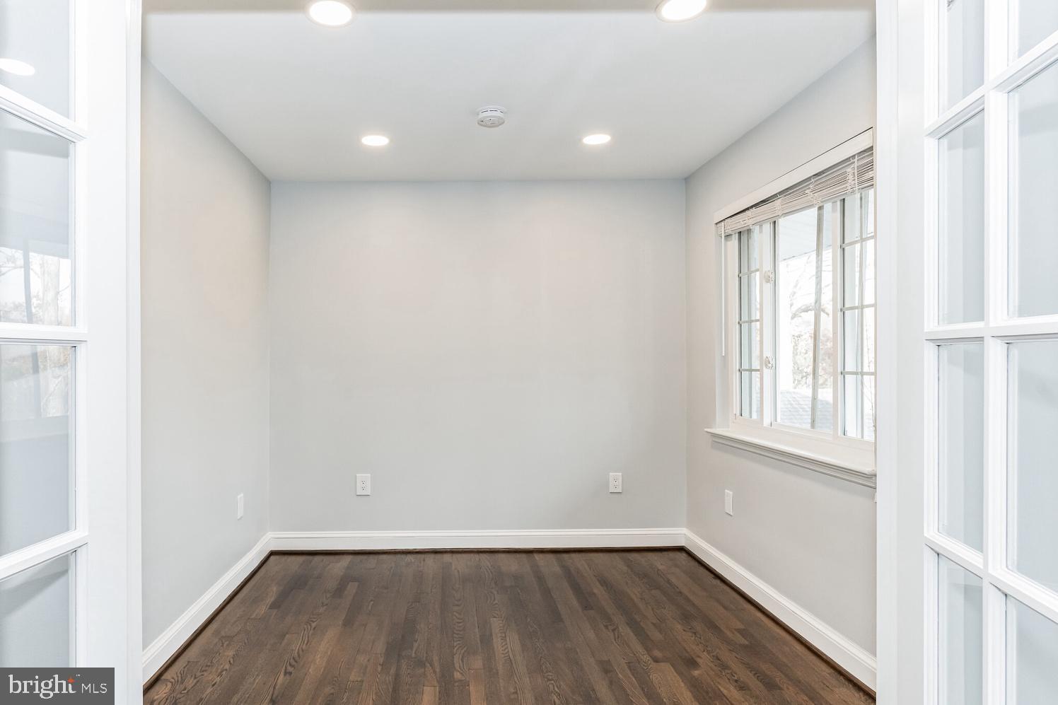 7016 Donna Circle Annandale, VA 22003 - Photo 4 of 30 a view of an empty room with wooden floor and a window