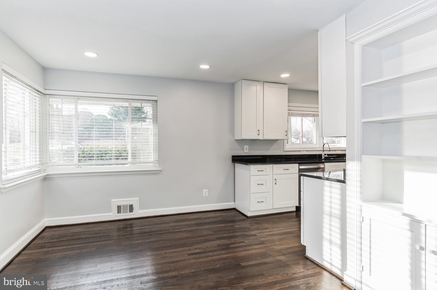 7016 Donna Circle Annandale, VA 22003 - Photo 5 of 30 a kitchen with a refrigerator and white cabinets