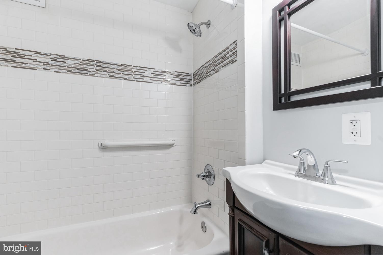 7016 Donna Circle Annandale, VA 22003 - Photo 10 of 30 a bathroom with a sink and a mirror
