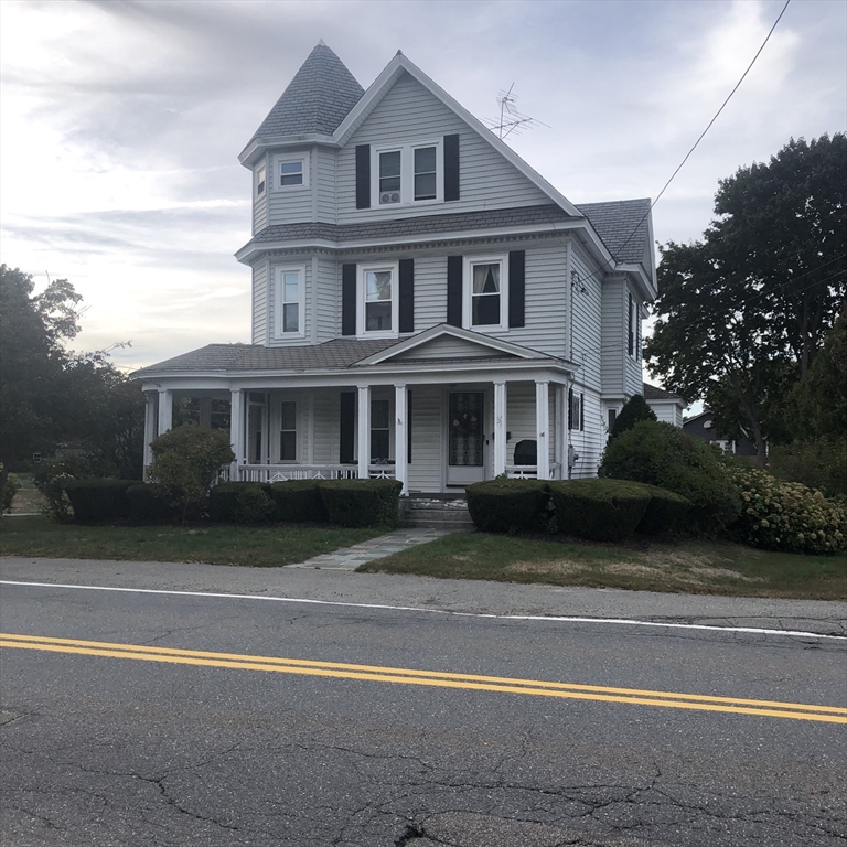 118 Chace Street Clinton, MA 01510 - Photo 1 of 41 a front view of a house with a yard
