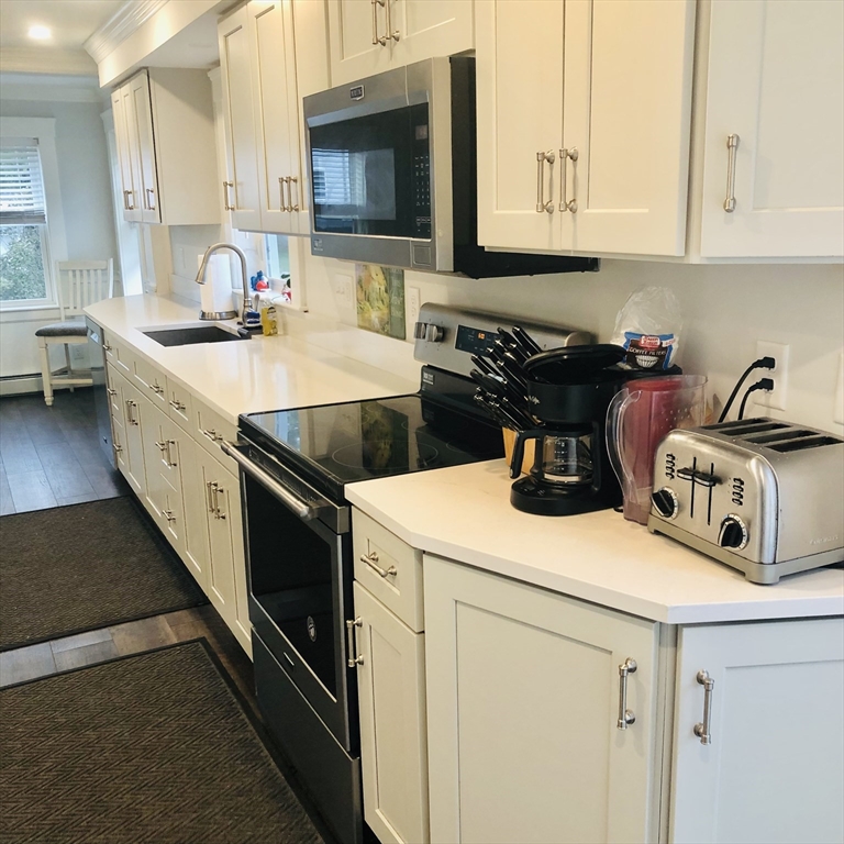 118 Chace Street Clinton, MA 01510 - Photo 13 of 41 a kitchen that has a sink and a stove