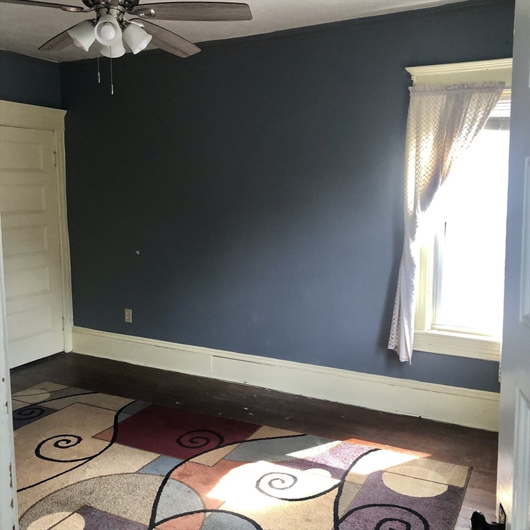 118 Chace Street Clinton, MA 01510 - Photo 37 of 41 a view of entryway and hall with wooden floor