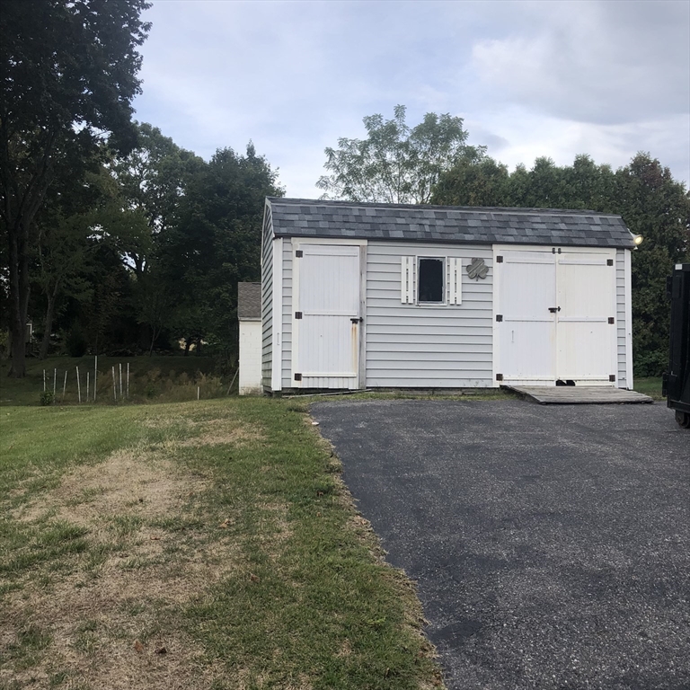 118 Chace Street Clinton, MA 01510 - Photo 5 of 41 a view of a house with a yard