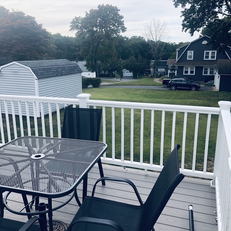 118 Chace Street Clinton, MA 01510 - Photo 6 of 41 a view of a chair and table on the deck